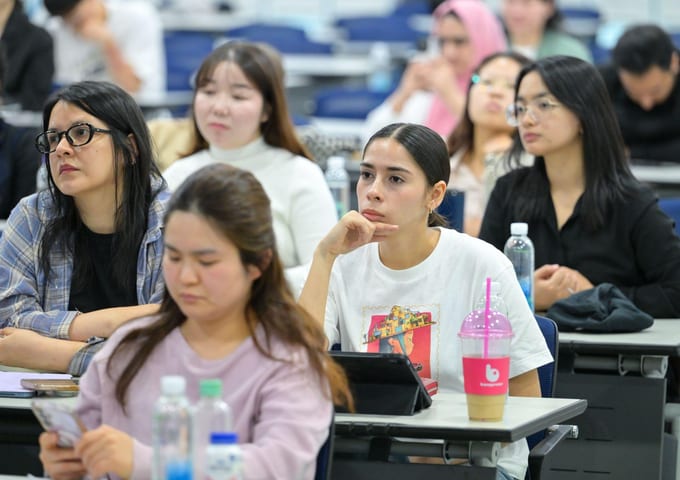 International students taking notes during a class session in Korea